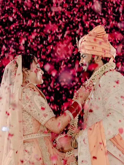 A magical shot from my wedding's Jaimala ceremony, showered with rose petals. This is the kind of picture-perfect, romantic moment that I love to enhance with beautiful live music.