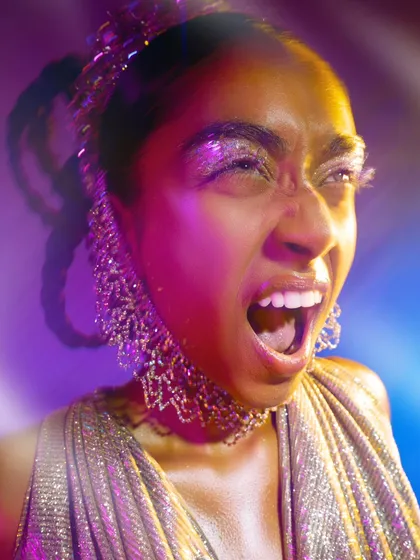 An expressive shot from a beauty editorial focused on glitter and light. I used a prism filter and colored gels to create the light flares and the vibrant, dreamlike mood.