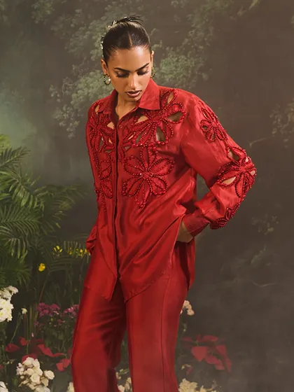 The Lunara Co-Ord Set in red, a statement of sophisticated allure for the bold and stylish with its refined floral cut-outs.