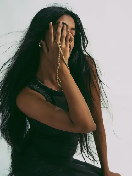 A similar shot, where the flowing hair partially obscures the face, creating a sense of mystery and artistry. It shows that hair can be used as a powerful compositional tool.