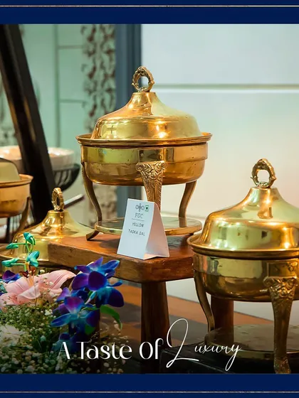 A taste of luxury. Our polished brass serving dishes are a signature element of our buffet setups, reflecting our commitment to quality and elegance in every detail.