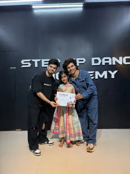 Mahira, one of our promising young dancers, with her completion certificate.