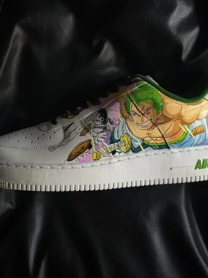 A side view of the Zoro-themed sneaker from the One Piece custom pair, highlighting his iconic three-sword style.
