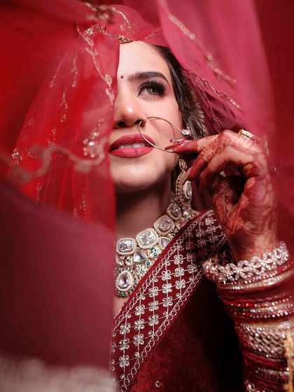 The classic peek from behind the veil. This shot highlights the beautiful eye makeup and lip color.