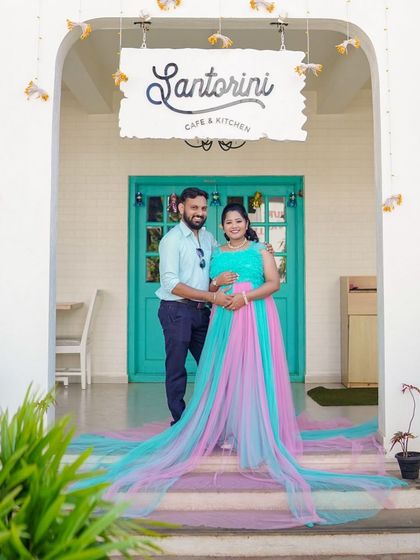 For a fun and unique look, I offer this dual-color pink and blue trail gown. It's a playful choice, especially for gender reveal or just a vibrant maternity shoot.
