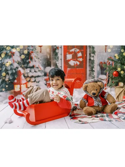 A collage of a happy boy in a sleigh, a perfect memory from our Christmas mini-session.