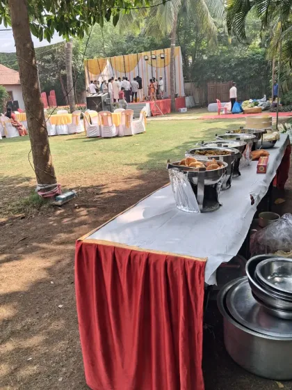 A long buffet line set up in an outdoor lawn for a haldi ceremony in Uran. I can set up my catering service in any kind of venue, indoor or outdoor.