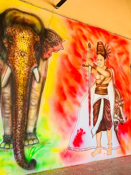 A powerful mural depicting a historical warrior and an elephant, bringing stories of Karnataka's valor and heritage to the school's walls.