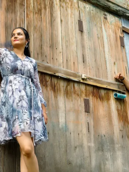 A casual and relaxed portrait from a pre-wedding shoot in Thailand, set against a rustic wooden building. This shows the variety of styles we can achieve in one location.