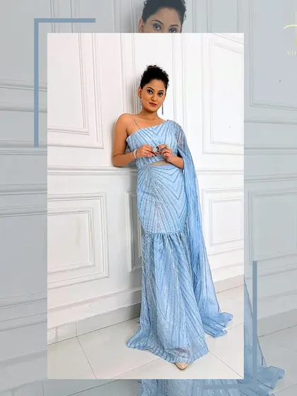 A relaxed pose in the ice-blue gown, showing how comfortable and stylish it is.