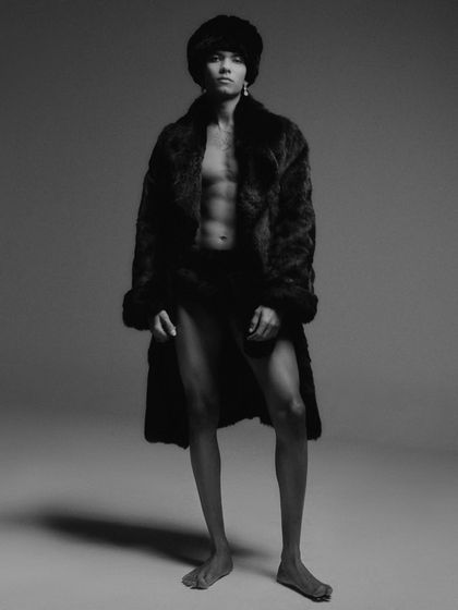 This shot combines the fur coat with the minimalist styling from the previous image. The composition is powerful and showcases my ability to create daring and unconventional editorial looks.