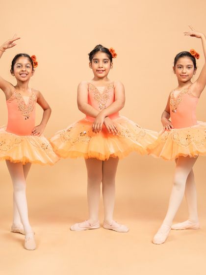 Our dancers are ready to grace the stage in 'The Waltz of the Flowers.' These photos capture their excitement and poise before bringing this timeless piece from The Nutcracker to life.