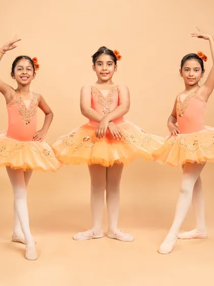 Our dancers are ready to grace the stage in 'The Waltz of the Flowers.' These photos capture their excitement and poise before bringing this timeless piece from The Nutcracker to life.