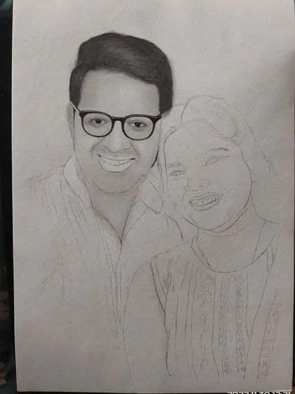Here, the man's face is shaded, but the woman's portrait is still a light outline. This shows how I build up the drawing one section at a time.