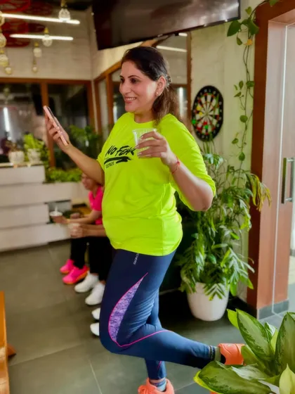 Striking a pose during a studio get-together. Fitness and fun go hand in hand here.