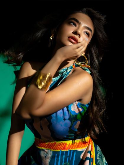 This shot from the same series incorporates a gold cuff, adding a point of interest and complementing the warm tones in the lighting.