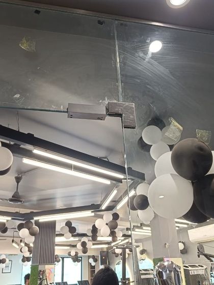 The corresponding EM lock installed on the gym's glass door. This complete setup ensures that only registered members with valid credentials can enter the facility.