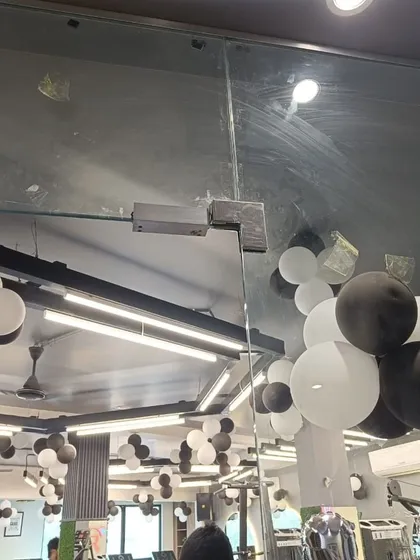 The corresponding EM lock installed on the gym's glass door. This complete setup ensures that only registered members with valid credentials can enter the facility.