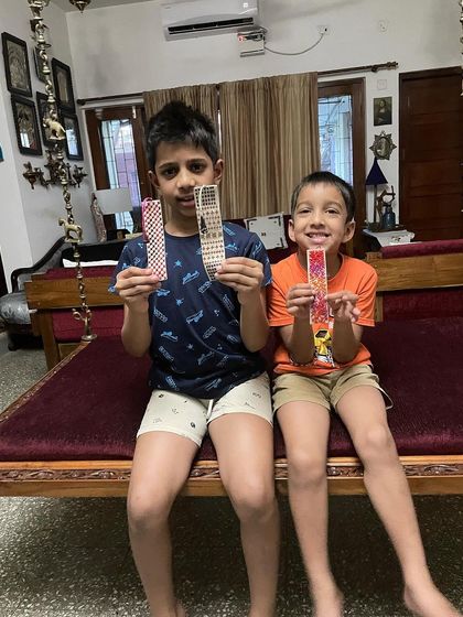 My two grandsons proudly holding up the bookmarks they made. It is so important to engage children in hand skills and watch them discover their own creativity.
