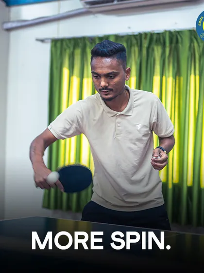 More spin. A coach demonstrates how to add spin to the ball, a key technique for controlling the game.