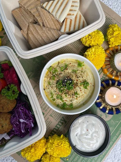 Our Pita Hummus meal with falafel, adding a crispy and protein-packed element to the platter. It's a complete and satisfying meal.