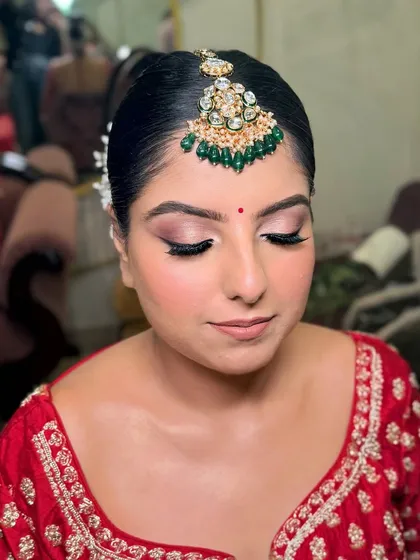 A close-up of Drishti's eye makeup for her pheras. A classic smokey eye with a touch of shimmer to make the eyes pop.