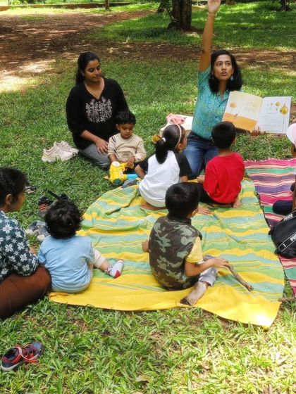 More moments of me reading to the group, using the book's illustrations to guide the story and capture the children's attention.