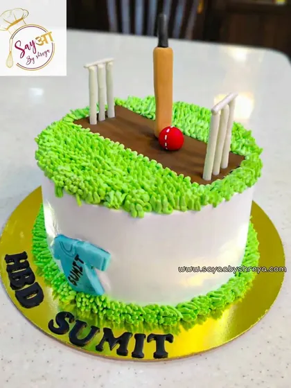 Another design for the fans of cricket. This one features a fondant cricket pitch on a bed of green buttercream grass, complete with a jersey, making it a great choice for any cricket-themed celebration.