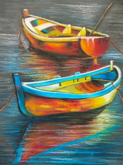 A beautiful oil pastel drawing of colorful boats on water. Our classes explore how to use oil pastels to create vibrant, painterly effects and reflections.