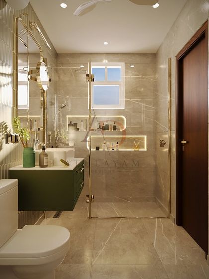 A modern bathroom with a rich green vanity, gold-accented fixtures, and unique hexagonal wall tiles, demonstrating luxury in a compact space.