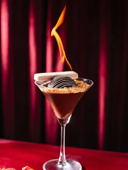 A dessert designed to be a showstopper. Our Chocolate Rum Ball, served in a martini glass and set ablaze, offers a moment of theatre and a rich, boozy flavor to conclude your meal. It’s the perfect finale for a memorable evening.