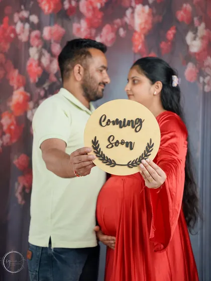 The classic announcement that starts it all. This couple portrait, using a simple "Coming Soon" sign, is a joyful and direct way to share your exciting news with the world.