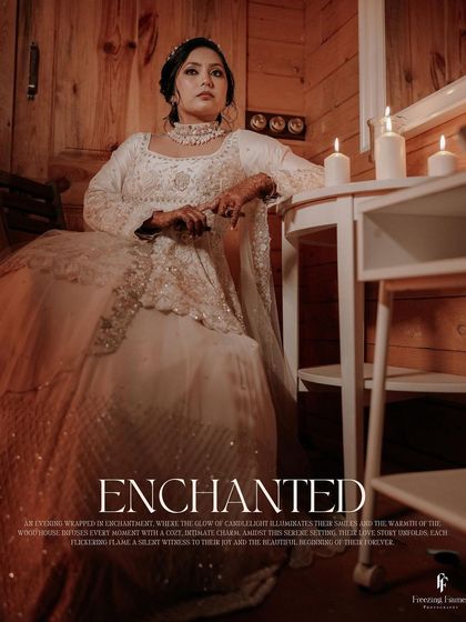 A portrait titled "Enchanted," showing the bride in a white gown in a cozy, candlelit, wood-paneled room.