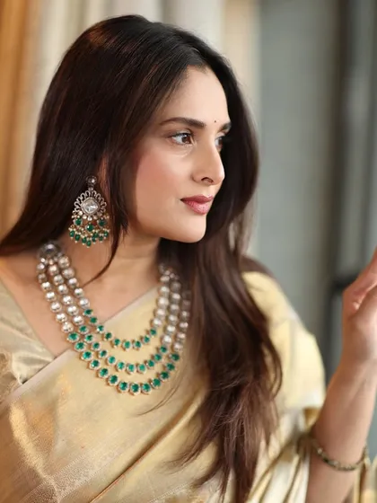 Another shot of the graceful Divya Spandana, showcasing her elegant side profile and the sophisticated makeup look.