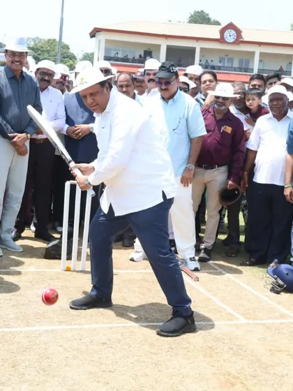 MLA Prashant Thakur facing a ball during the inauguration, sharing in the spirit of the game.
