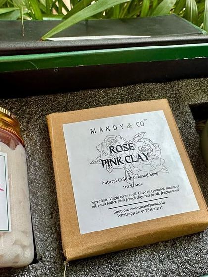 The 'Rose Gift Box,' a perfect token of love for the festive season. This luxurious hamper includes a Rose Whipped Soap, a Rose Pink Clay artisanal bar, and a Rose Soy Candle.