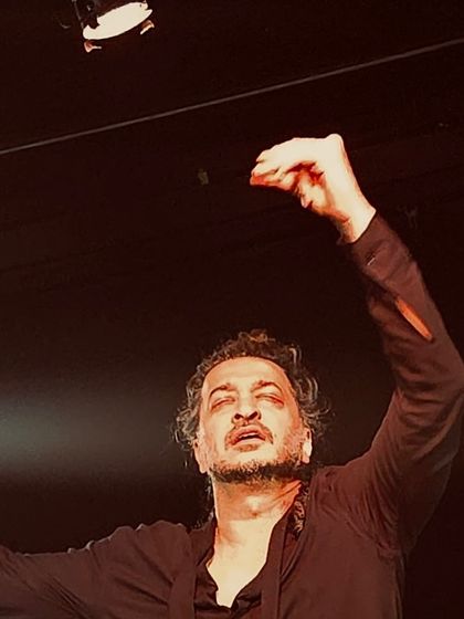 A close-up, emotional moment from an intimate performance.