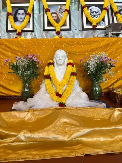 A special altar set up to honor Swami Kriyananda's discipleship anniversary. The statue of Mahavatar Babaji is adorned with a beautiful garland, symbolizing our devotion to the entire lineage.