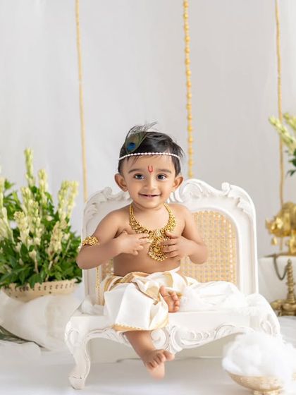 A full view of the elegant white and gold Krishna setup. This little one looks so regal on his tiny throne.