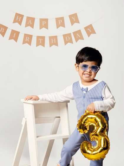 Turning three with the coolest cheer squad. This simple, classic birthday setup puts all the focus on the birthday boy and his happy milestone.