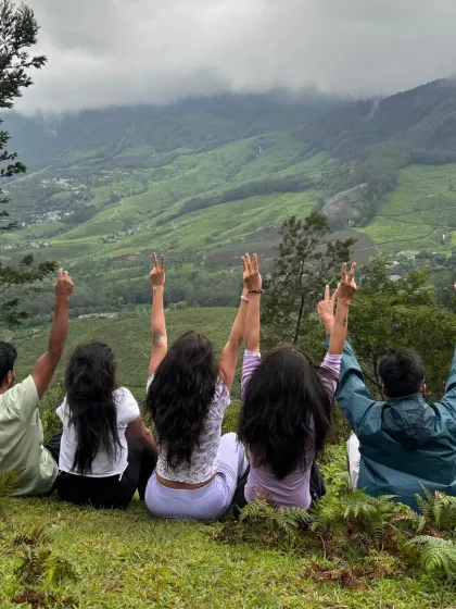 It's not just about tough treks. We also unwind in the serene landscapes of South India's hill stations, like here in Munnar, taking in the vast, peaceful tea garden valleys.