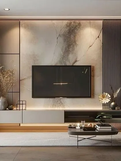 This TV unit design combines a marble-effect back panel with dark wood and grey tones for a moody, sophisticated look. The asymmetrical design adds a modern, artistic touch.