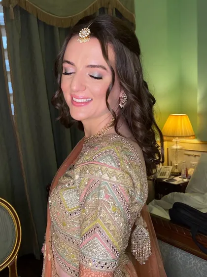 A side profile showing off the soft curls and the beautiful, subtle makeup. It’s all about enhancing, not overpowering.