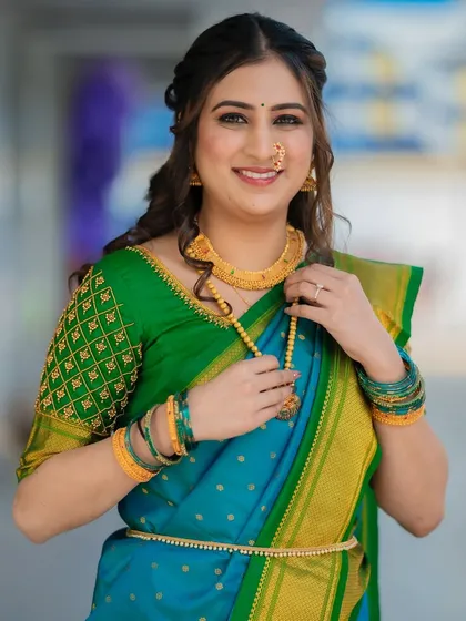 A fresh and flawless engagement look. The combination of a blue and green saree is so vibrant, and I paired it with minimal makeup to keep the focus on the bride's natural beauty.