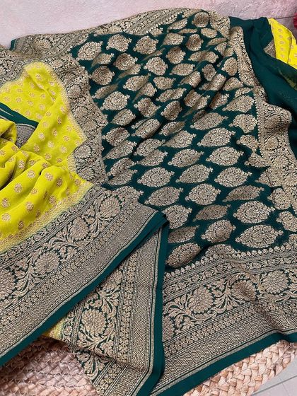 The full look of the lime green and bottle green Kadi georgette saree, showing the contrast between the dotted body and the heavily woven pallu.