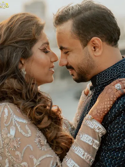 An intimate close-up of the couple, nose-to-nose, capturing the romance and emotion of the moment.
