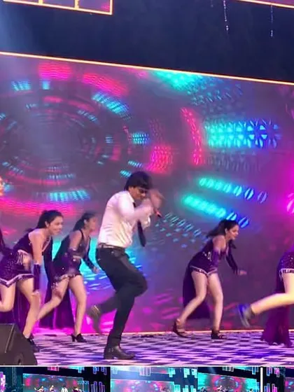 Another angle of our dynamic performance in Surat. The colorful LED background and energetic dance moves create a vibrant spectacle.