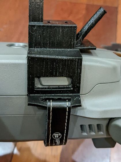 A side profile of the 3D-printed mount holding the FPV camera and antenna on the Mavic 2 Pro. This custom gear is essential for achieving a true first-person perspective with a cinematic drone.