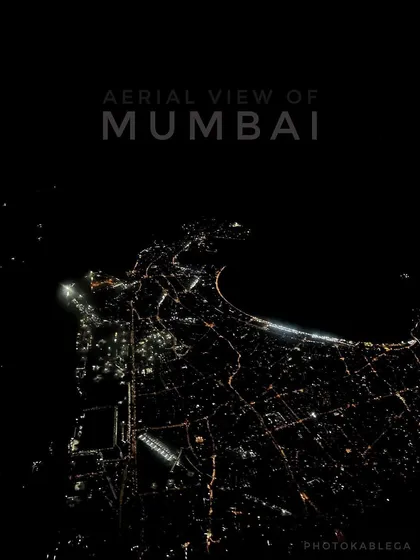 Mumbai transforms at night, and this is its electric pulse seen from above. This aerial night shot captures the iconic Queen's Necklace and the city's grid of lights. Capturing clear, detailed nightscapes requires specialized drone equipment and piloting skills to manage low-light conditions.