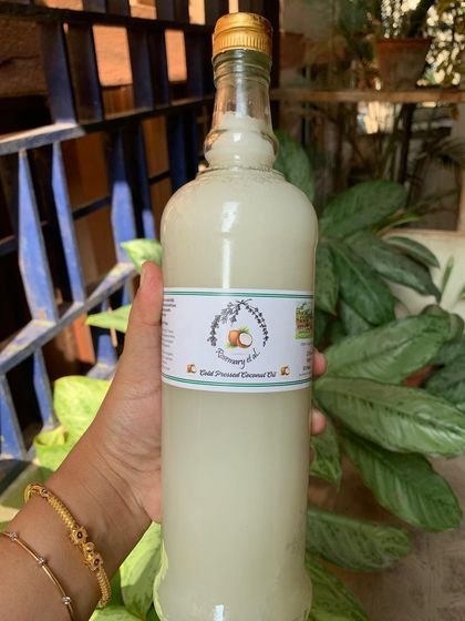 This is our signature cold-pressed coconut oil, bottled and ready for your kitchen. We make it from coconuts grown by the Kaveri river on our estate, and its pure, fragrant quality is perfect for cooking.